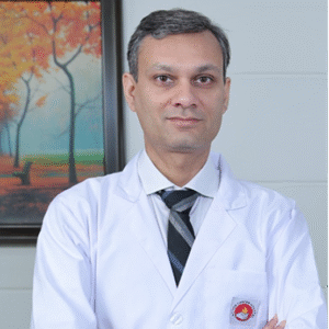 Dr. Tushar Aeron consulting a patient as a GI surgeon in West Delhi